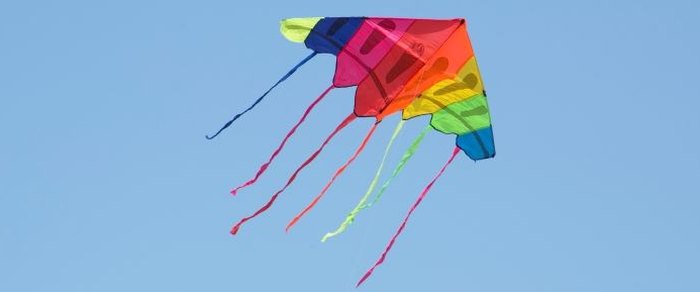 A kite flying against an open sky