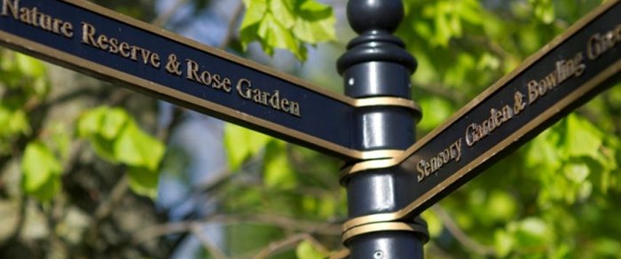 A city-centre fingerpost sign in Preston pointing to local destinations