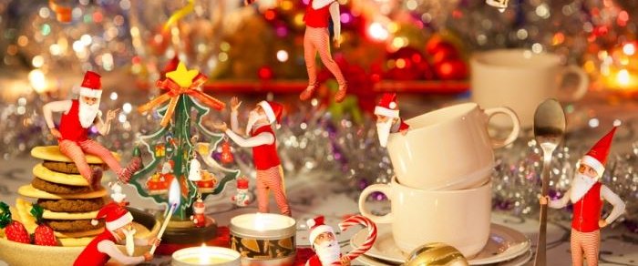 Christmas decorations and crockery arranged on a table