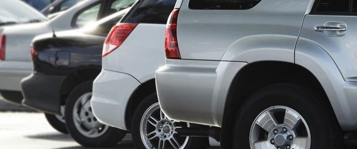 Parked cars filling the frontage of an out-of-town retail park